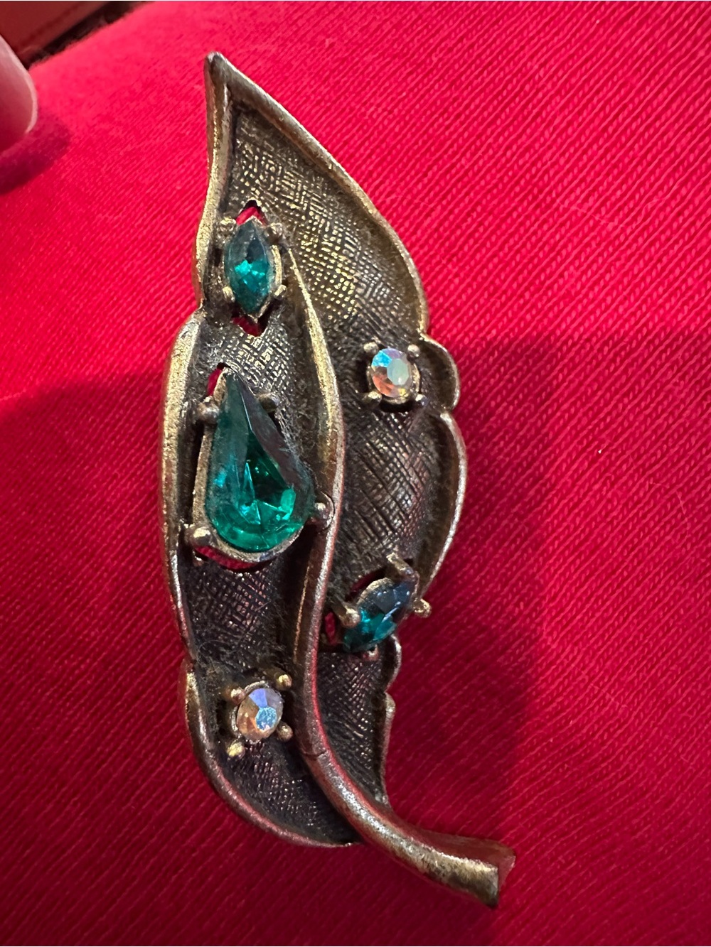 Vintage circa 1950s green and aurora borealis rhinestone leaf brooch